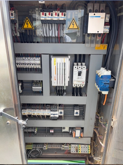 Electrical control panel with organized wiring and components.
