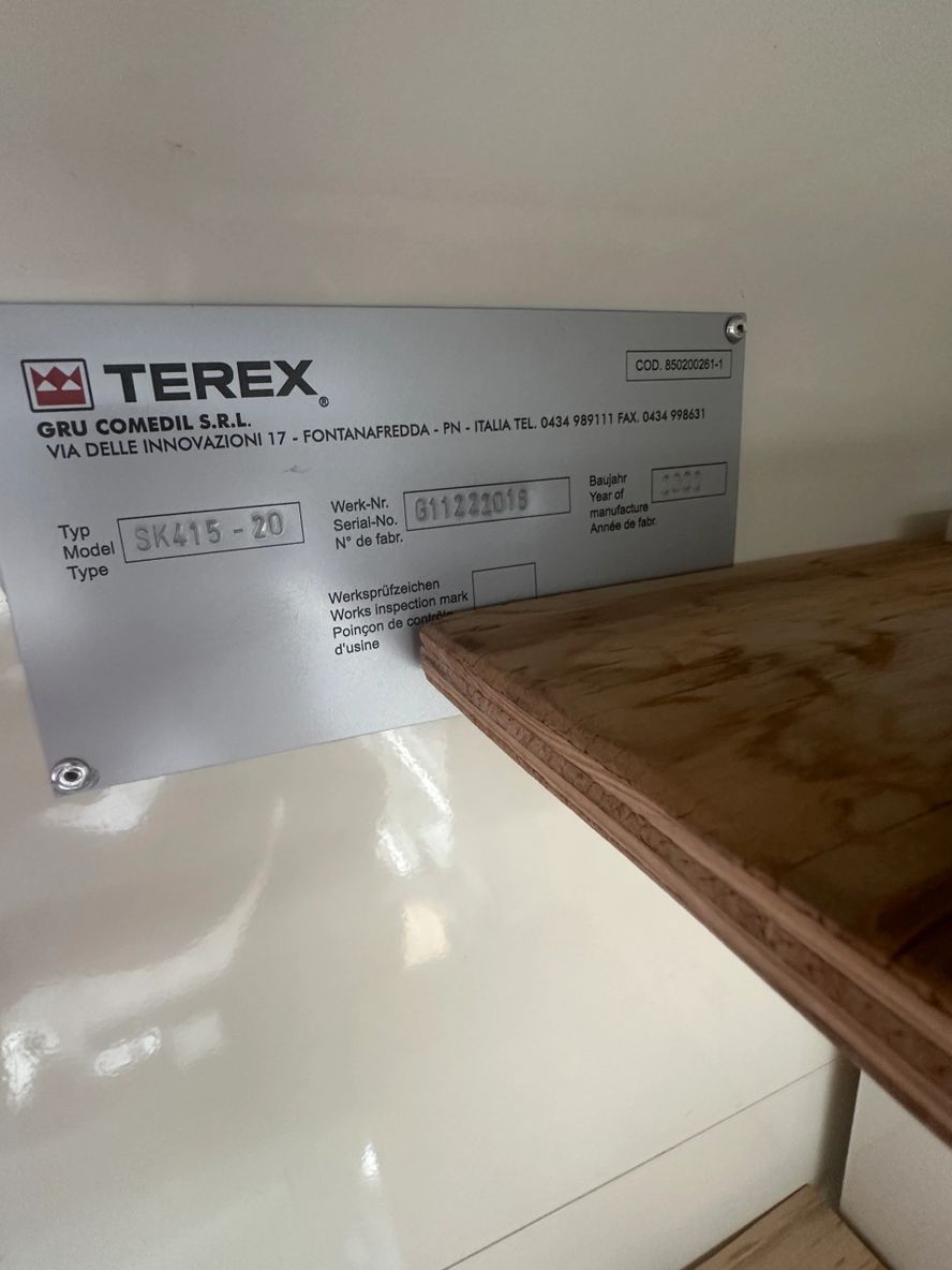 Terex equipment label showing model and serial details.