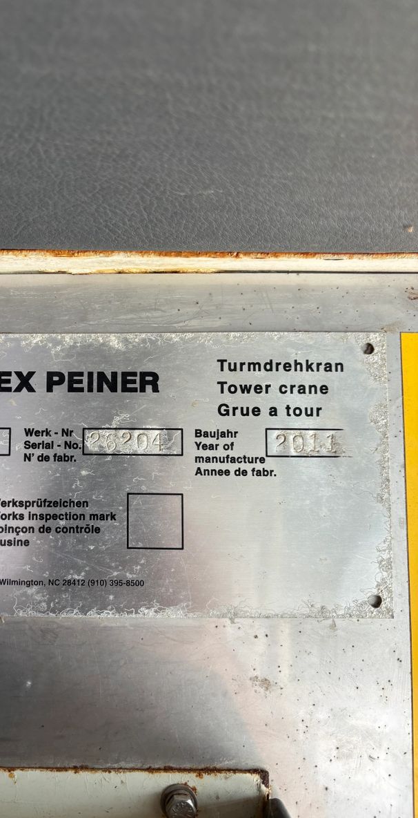 Informational sign for the Peiner tower crane with specifications and historical details.