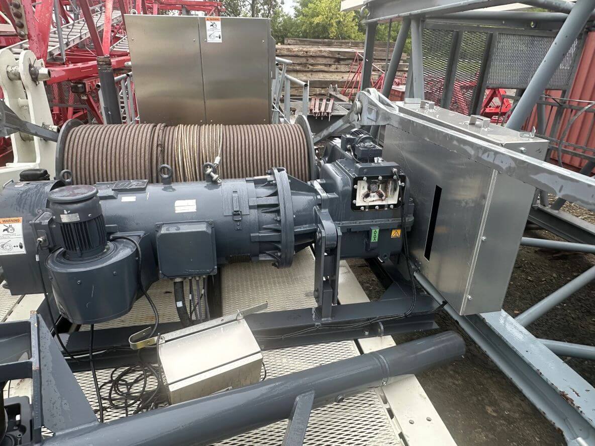 Industrial machinery with electrical components and wiring setup outdoors.